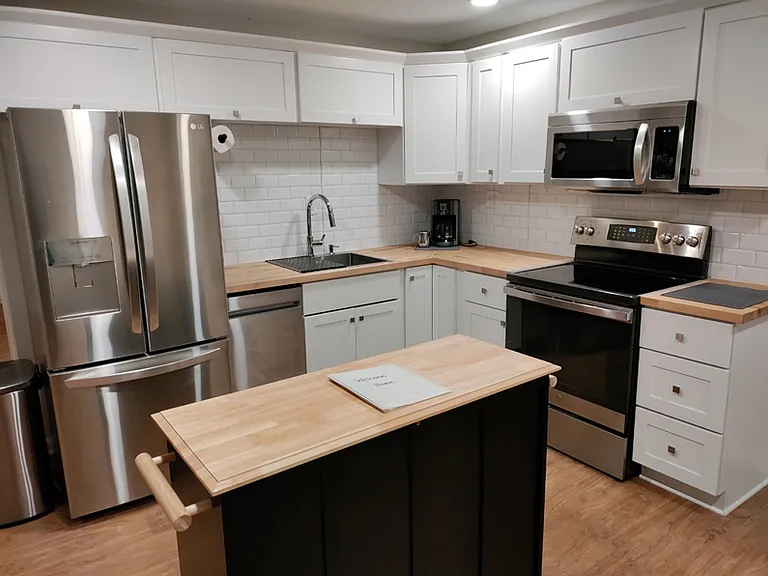 Stainless steel appliances. Range with air fryer feature included.