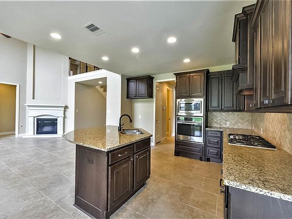 14x14 Kitchen - The far wall has a built-in microwave and convection oven to inspire the creative cook.