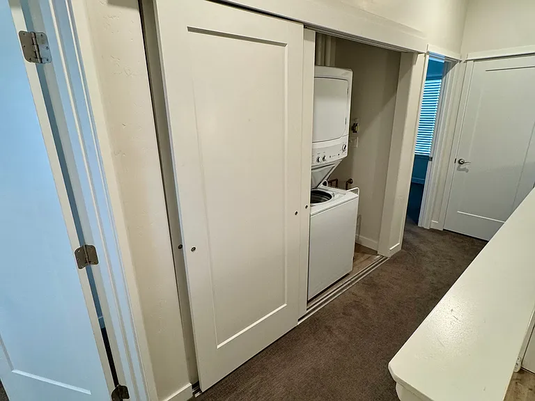 Hallway between bedrooms with Laundry