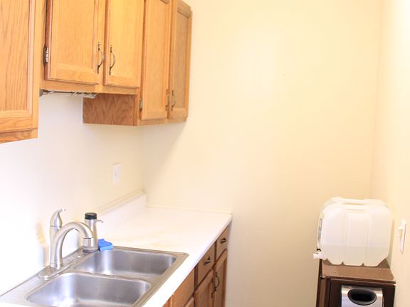 New faucet with double basin sink & lots of cabinet space fo