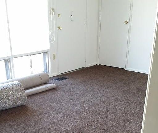 Living room right after carpet was installed 1 of 2