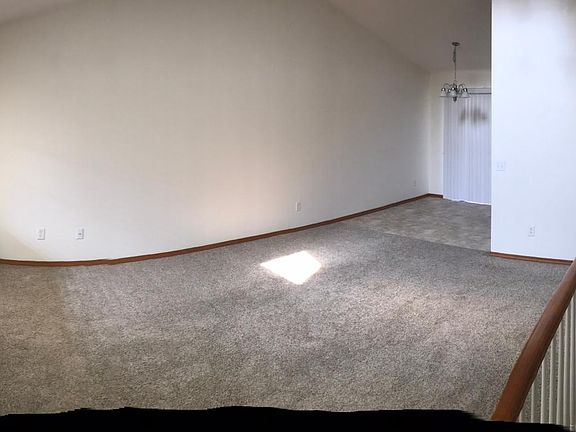 Upstairs Living Room and view into Kitchen dining area