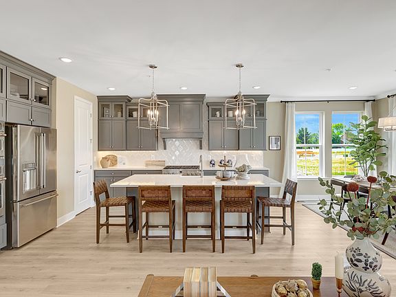 Kitchen with Greyhound cabinets and upper glass cabinetry
