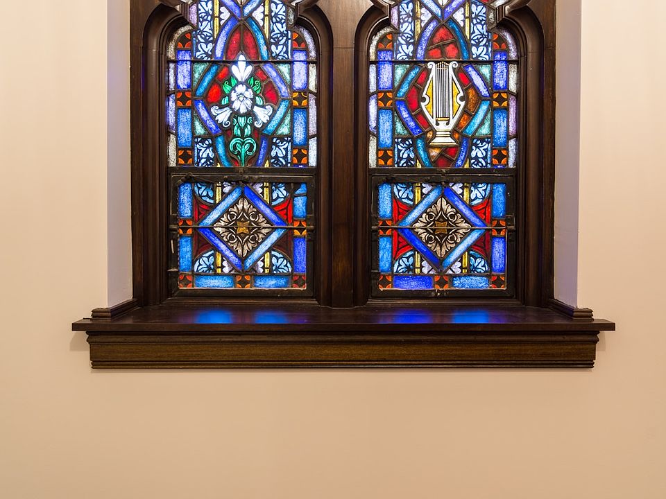 Art glass window in bedroom