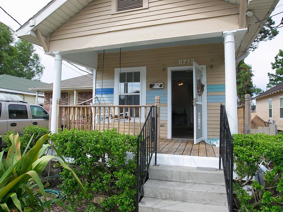 Front porch with porch swing.