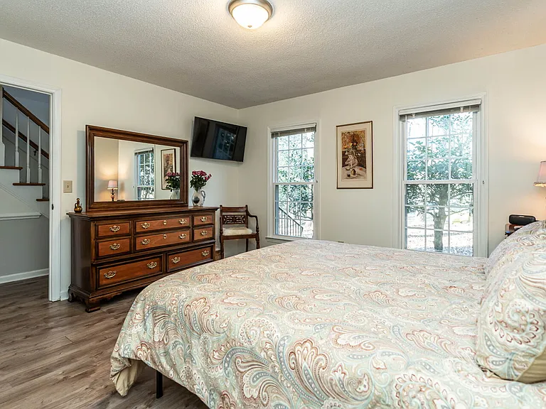 This dresser is solid pecan and cherry wood, recently refinished. Duvet covers are all high thread count cotton as are all the sheets. Luxury and elegance is yours in this home away from home.