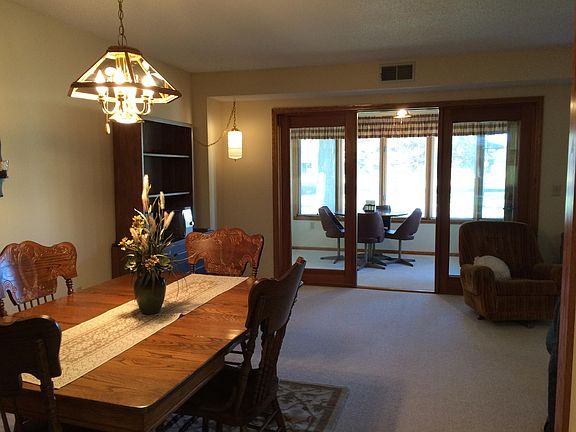 Dining room.  Four season porch ahead with a lovely view of 