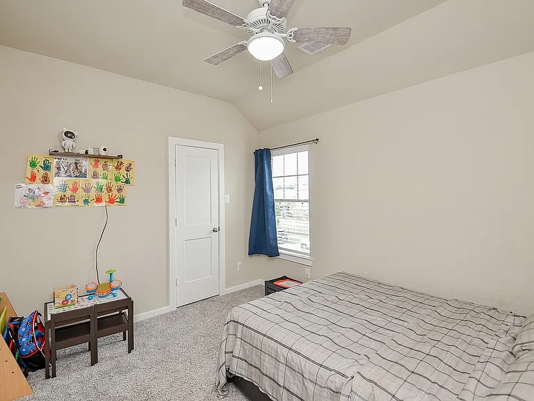 First room upstairs. Standard closet and window.