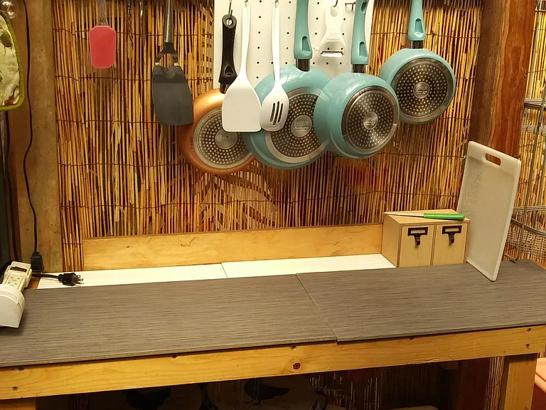 outdoor covered "lanai spot" provided 2 burner hotplate for basic meals, plus long countertop. (not shared area).