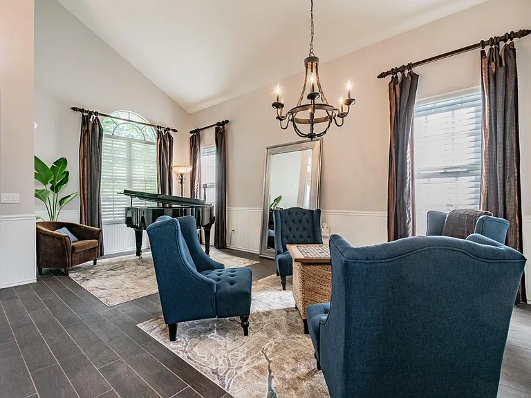Living Room with Piano and Conversation Set