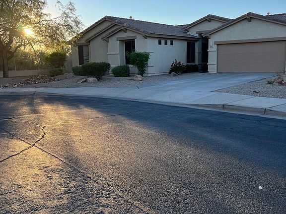 Home is adjacent to wash on two sides, with view fencing.
