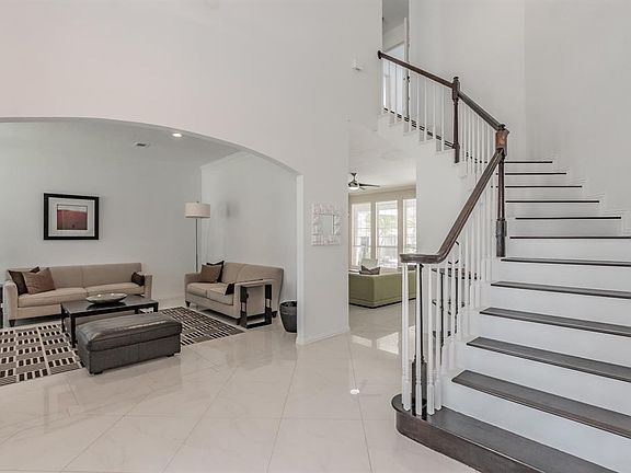 Grand entryway leads to the formal living area to the left.