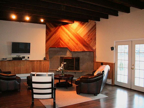 Family room  High beamed ceilings, a fireplace and a definite wow factor!