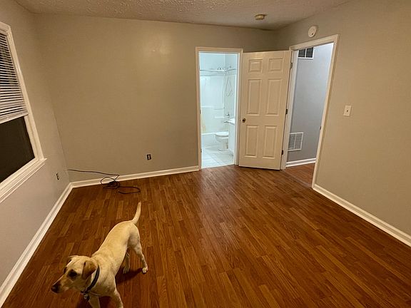 Master bedroom with attached full bath and walk in closet