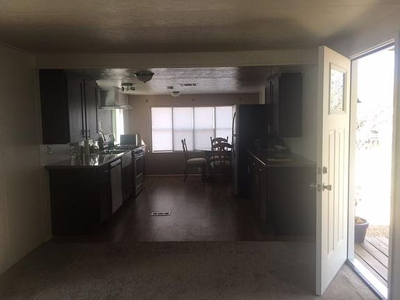 Picture of kitchen from family room. All stainless steel appliances less than 3 years old.