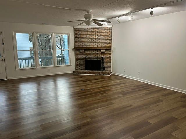 Living / Dining / Fireplace with view of rear deck