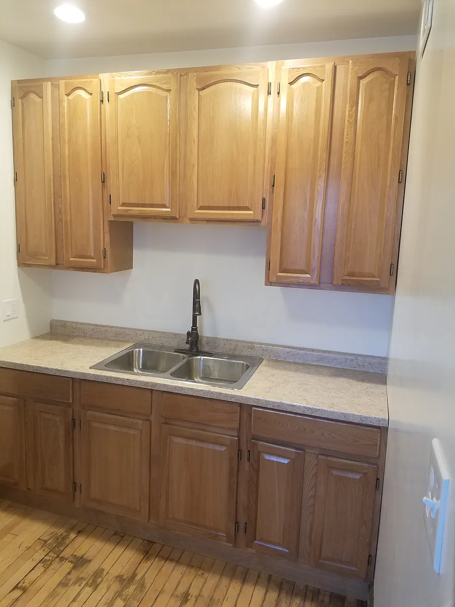 Kitchen with high cabinets - 5348 W Potomac Ave #1