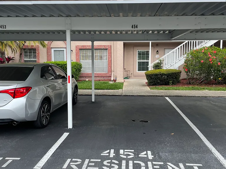 DESIGNATED PARKING SPACE JUST STEPS FROM THE FRONT DOOR-NO STAIRS