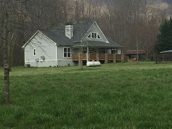 House with wood shed.