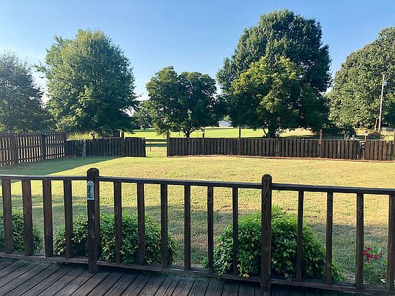 Property line behind trees 