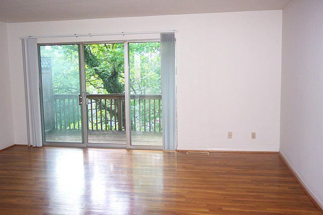 Light filled living room with balcony