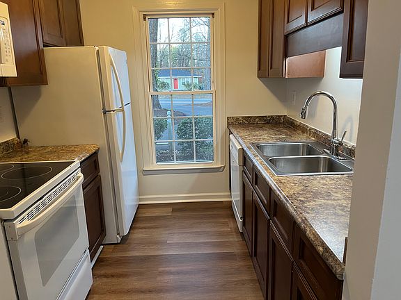 Galley Kitchen with solid wood cabinets