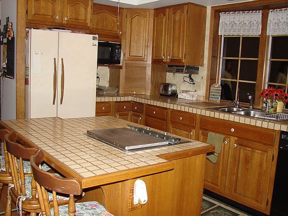 beautiful kitchen with grill center isle.