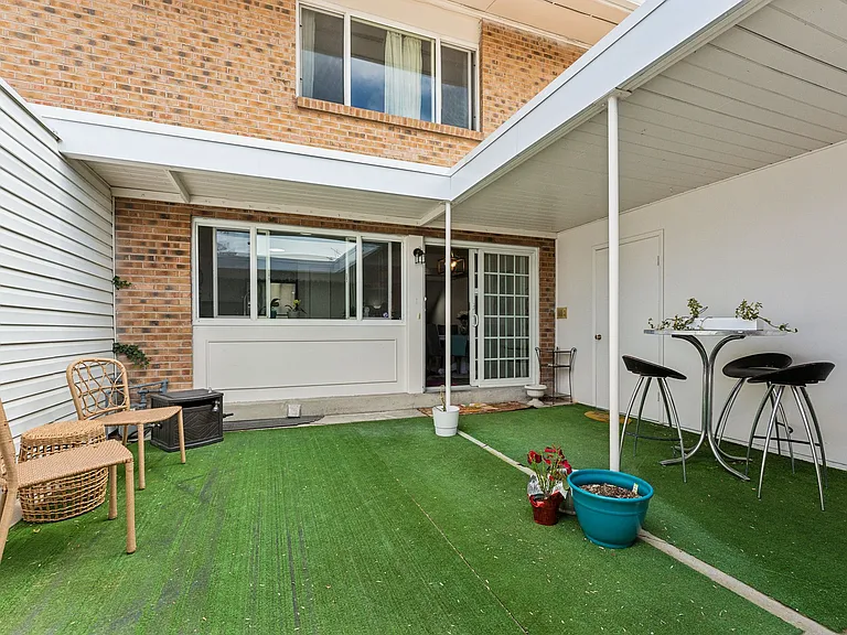 Rear patio easily accessed from kitchen.