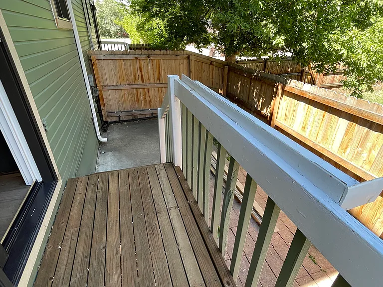 Back deck leading to private fenced patio