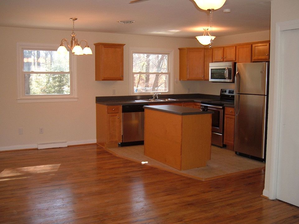 Open kitchen with new birch cabinets, new counters, new stainless appliances!