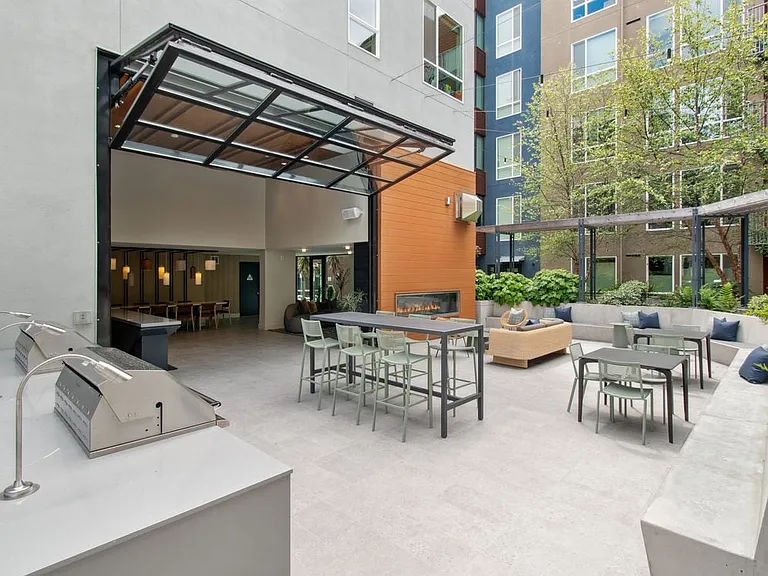 Outside resident lounge with common area seating and fireplace