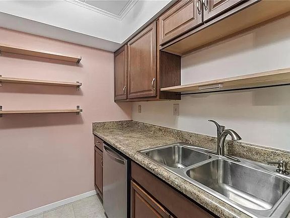 Kitchen with garbage sink disposal and dishwasher.
