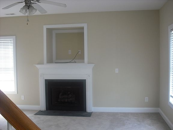 Living Room w/ Fireplace and TV Cubby.