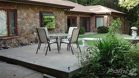Large concrete patio shown.