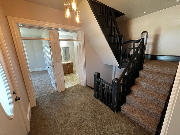second floor landing looking towards bathroom and larger bedroom