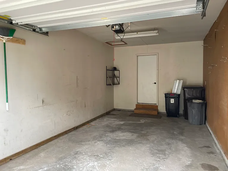 One car attached garage with opener.