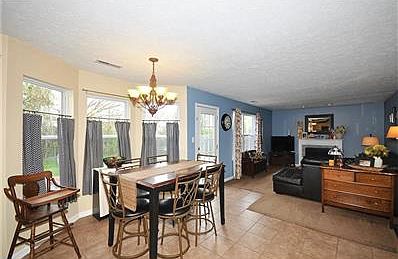 Spacious & open Family Room/Brkfst. Room & Kitchen. Note Ceramic tile in Brkfst room and off the rea