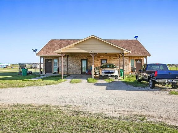 This is the front view of the Duplex.  The street address is 9616 A and B Swafford Road.  It is approx. 2500 sq ft total with Side A consisting of 2 beds, 2 baths, and side B consisting of 3 beds, 2 bath.  Both with a carport and circle drive. Each side d