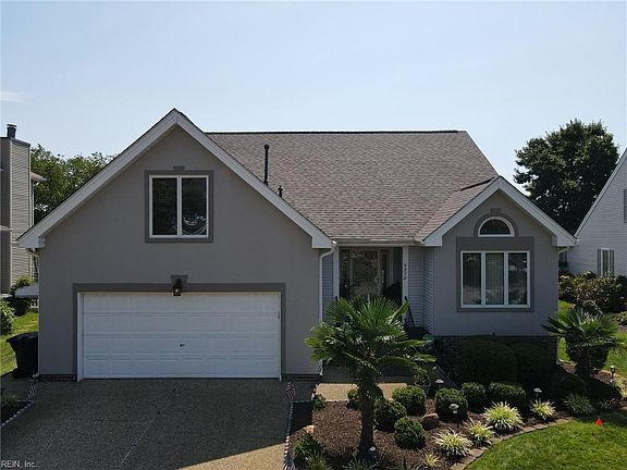 Stately home with a nice two-car garage.  Primary bedroom overlooks the lake.