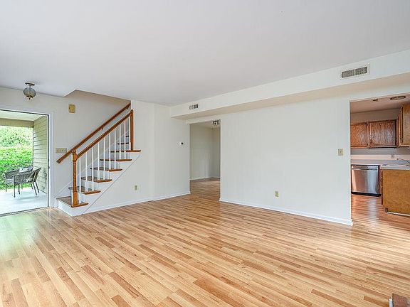 Entrance opens onto the main living room with views into the kitchen