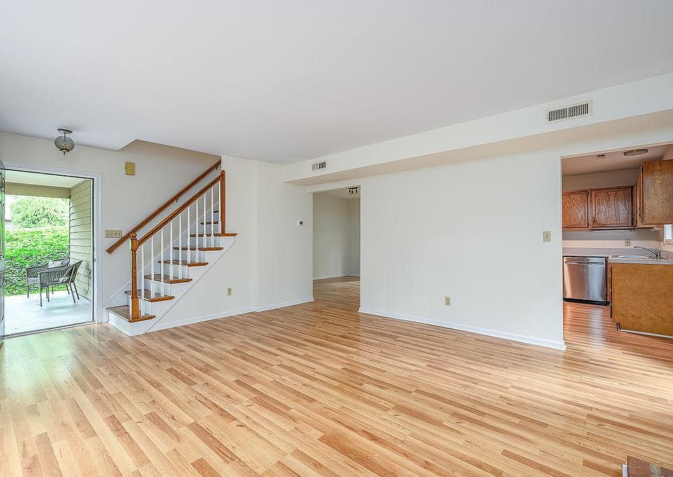 Entrance opens onto the main living room with views into the kitchen