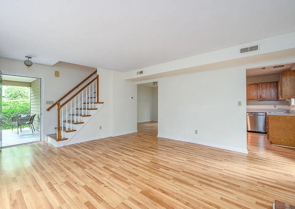 Entrance opens onto the main living room with views into the kitchen
