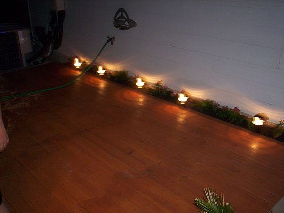 night time with patio lights and flowers