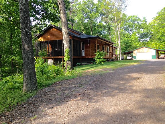 Cedar ranch/garage on 5 ac.