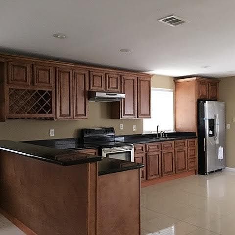 SPACIOUS KITCHEN WITH STAINLESS STEEL APPLIANCES