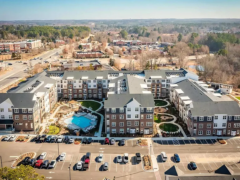 Aerial View of Alta Wren Apartments with Landscaped Courtyards, Pool Area, and Resident Parking