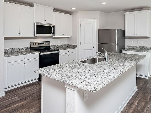 Kitchen with large granite island