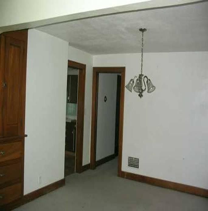 Formal Dining Room Looking into Hallway to bedrooms & into Kitchen (left side).