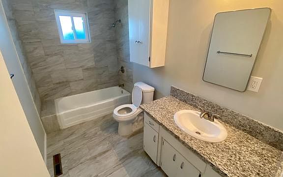 New tile, counter top, fixtures, & toilet