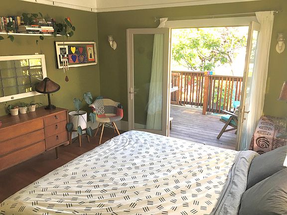 Master bedroom with King and French doors to the deck